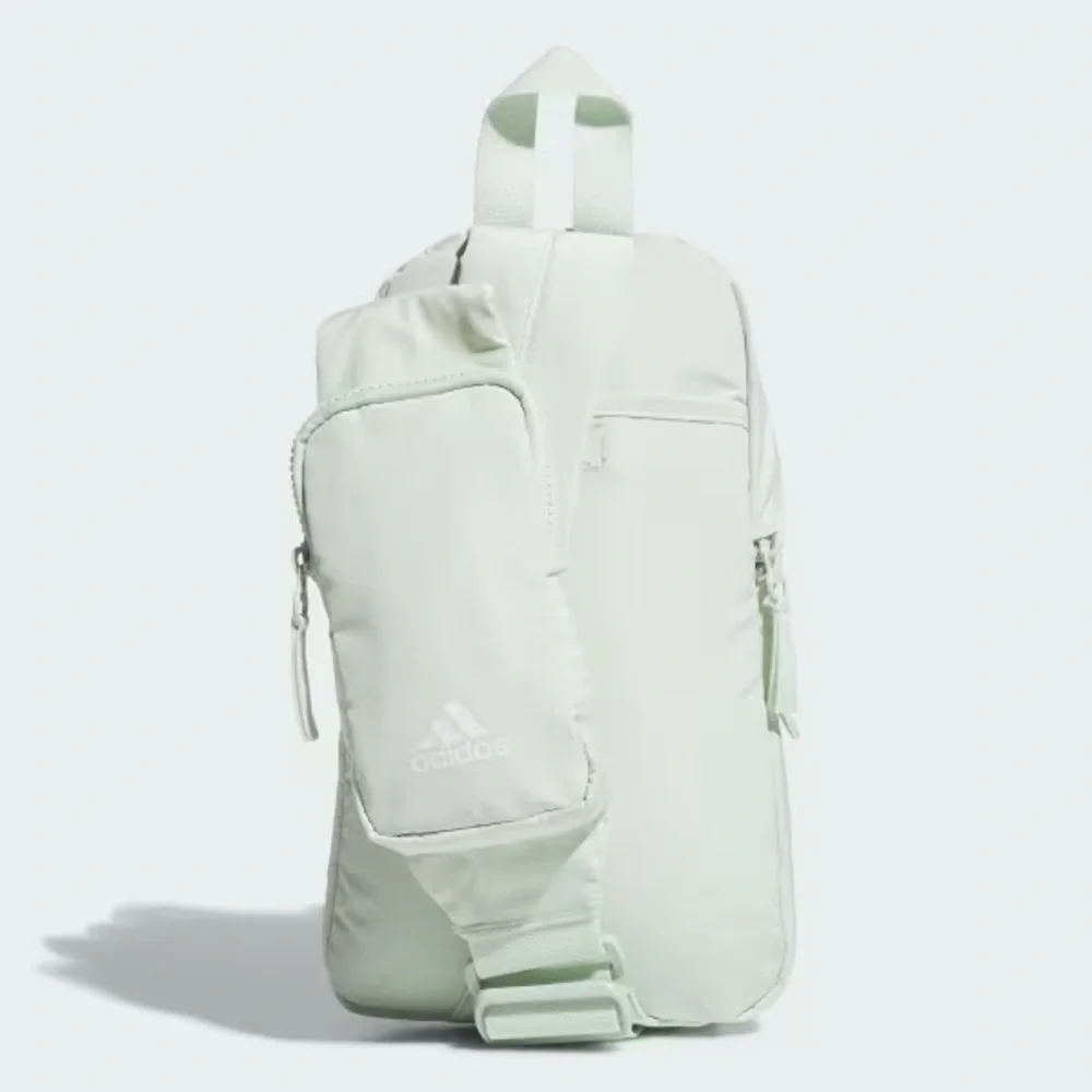 Adidas ESSENTIALS 2-SLING CROSSBODY BAG in Linen Green.  NWT